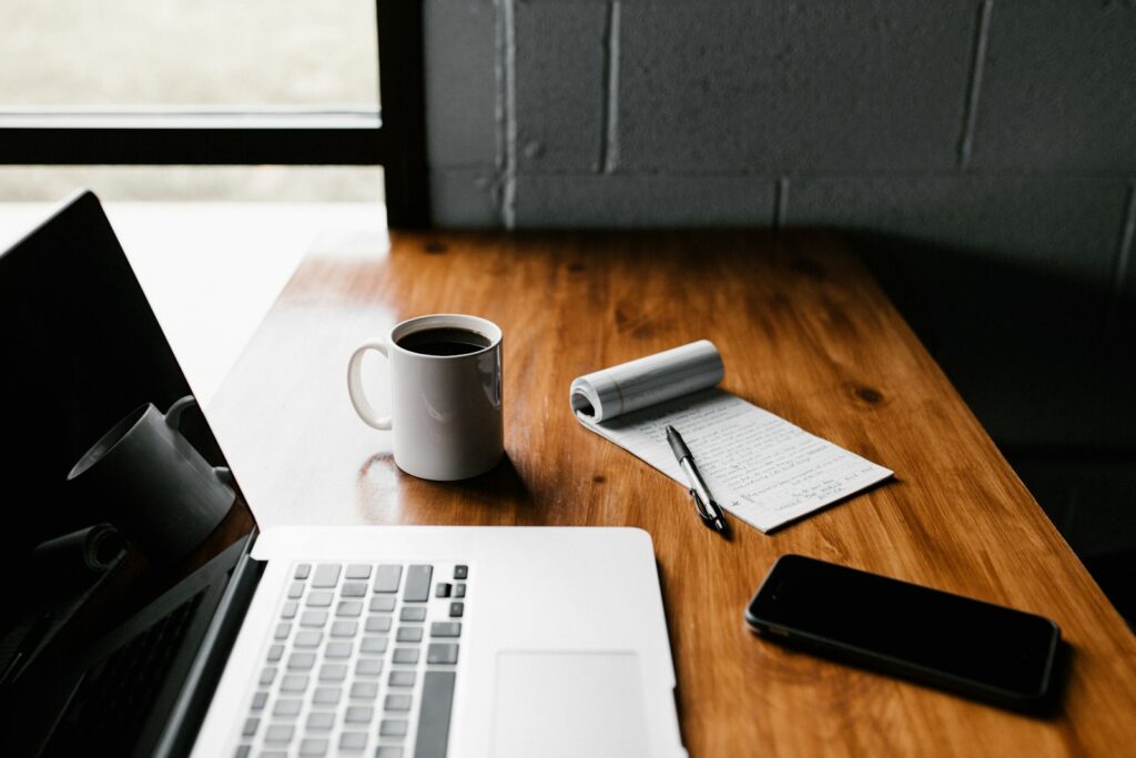 Content marketing writer working at a laptop with notes