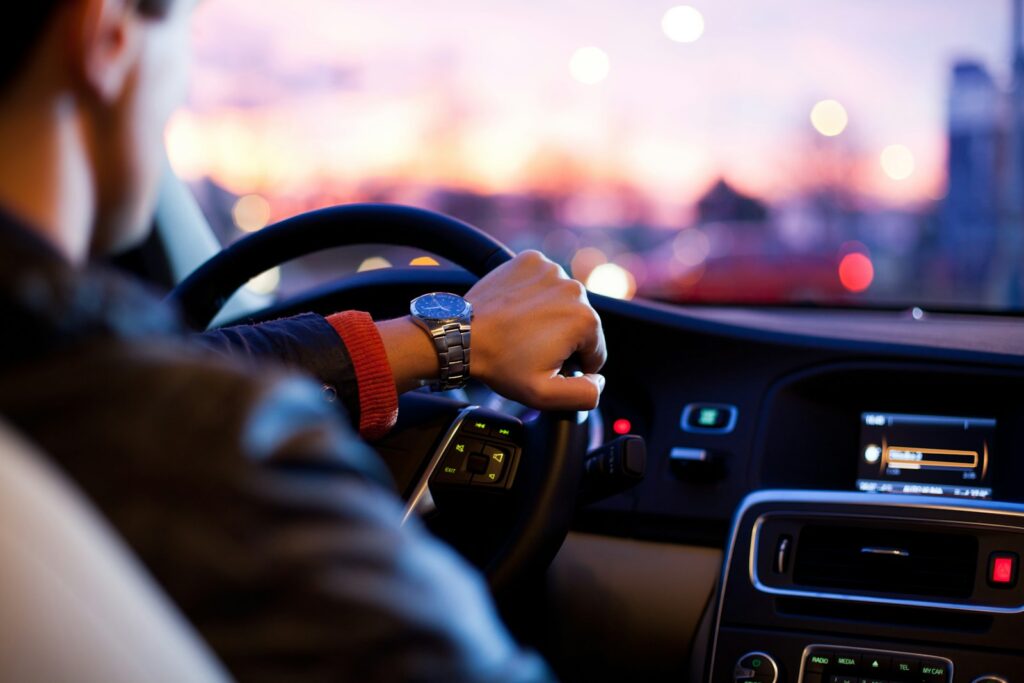 Hands on steering wheel driving safely on the road